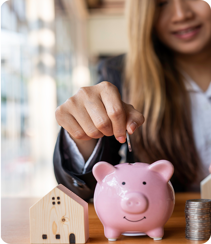 businesswoman-putting-a-coin-at-the-piggy-bank-it-2025-02-19-14-25-28-utc